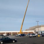 Crane lifting commercial HVAC equipment