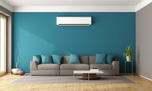 Ductless unit over a couch in a living room
