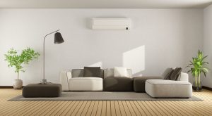 Living room with ductless unit over a couch