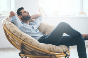 Man seated in chair relaxed